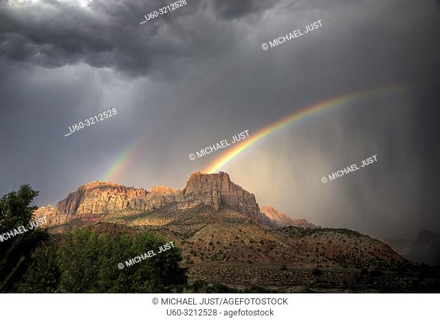 A rainbow appears during a monsoonal thunderstorm at Zion National Park, Utah