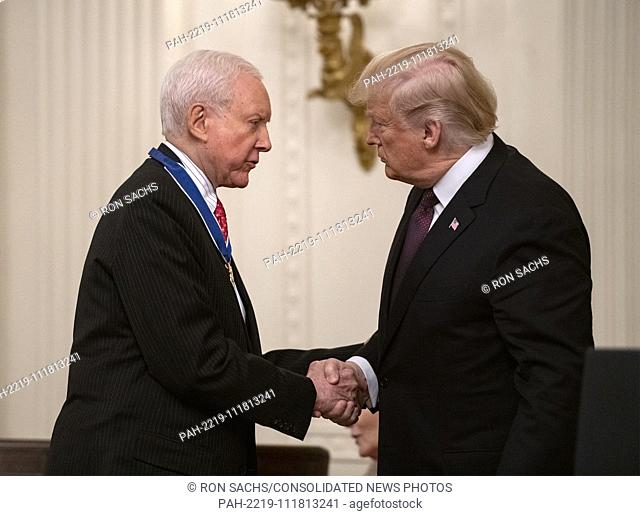 United States President Donald J. Trump, right, shakes hands with US Senator Orrin Hatch (Republican of Utah), left, after awarding him the Presidential Medal...