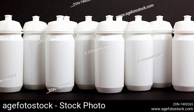 White water bottles isolated on black background