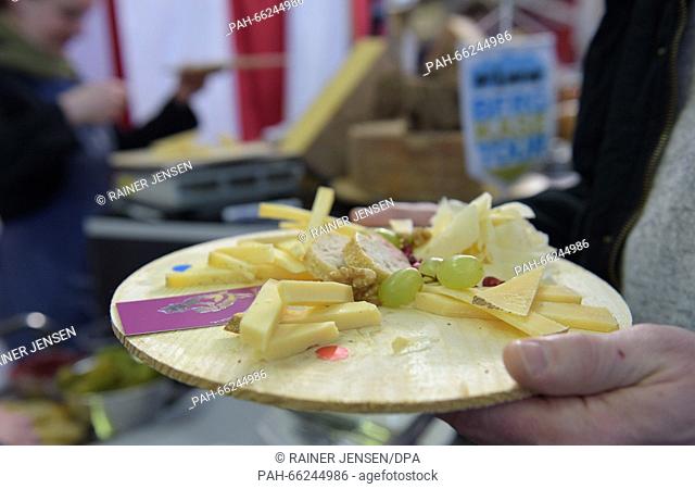 Different kinds of cheeses are offered during the Berlin Cheese Days in the Arminius Market Hall in Berlin, Germany, 28 February 2016