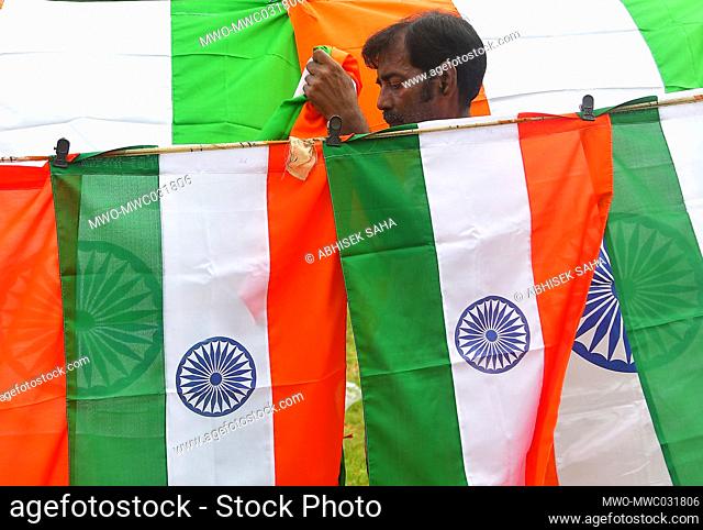 People selling the national flag of India ahead of the Independence Day celebrations, in the outskirts of Agartala, Tripura, India