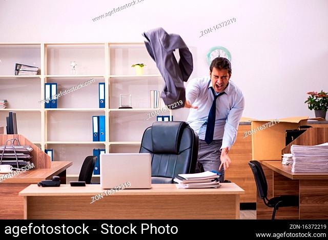 Young employee being dismissed from his work