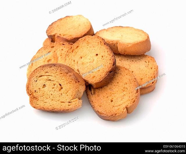 Pile of wheat baked rusks isolated on white
