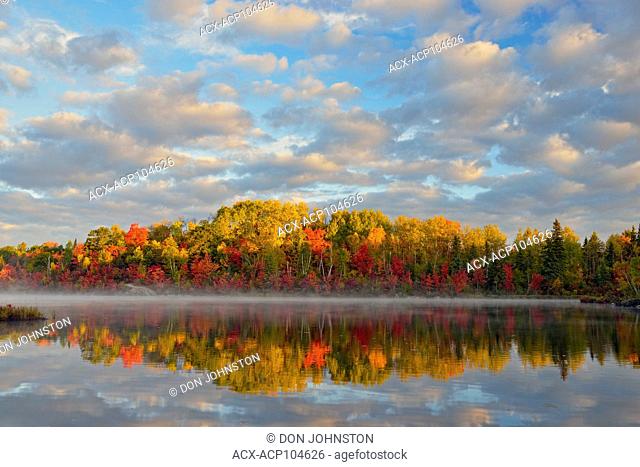 Autumn reflections in St. Pothier Lake, Greater Sudbury, Ontario, Canada