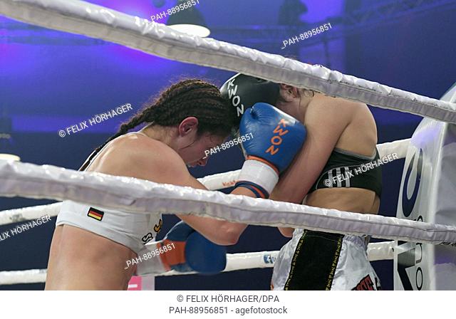 Kickboxer Marie Lang (Germany) (l) and Rachida Bouhout (Netherlands) in action during the Stekos Fight Night at the Postpalast in Munich, Germany, 11 March 2017