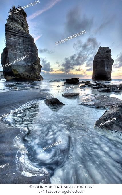 Two Sisters formerly Three sisters until one rock stack fell over, sunset, Tongaporutu, North Taranaki
