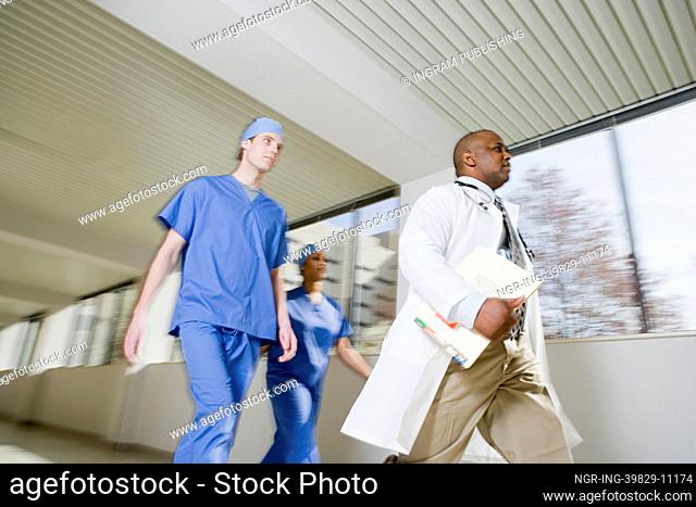 Doctor and surgeons walking