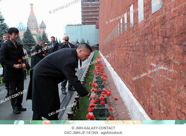 At the Kremlin Wall in Red Square in Moscow, Expedition 4243 backup crewmember Kjell Lindgren of NASA lays flowers Nov. 6 at the site where Russian space icons...