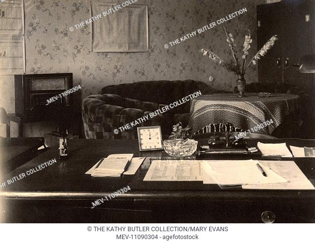Officer's desk in an office with charts and maps on the wall, British Army of the Rhine, near Braunschweig (Brunswick), Lower Saxony, in postwar Germany