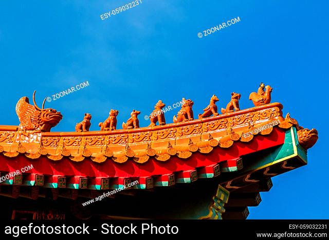 Beautiful Chinese temple roof detail with colorful architectural work at Wat Leng Nei Yi 2, Nonthaburi, Thailand