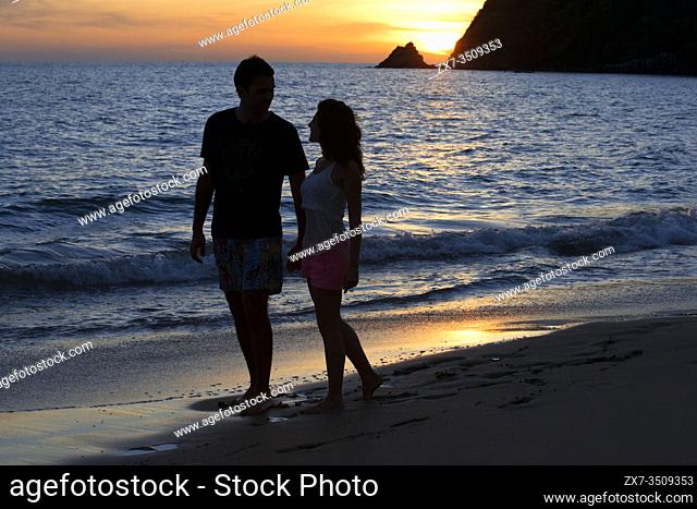 Couple lovers kissing at sunset in the beach. Kantiang Bay. Koh Lanta. Thailand. Asia. Kantiang Bay is most famous as the location of Pimalai, Koh Lantaâ