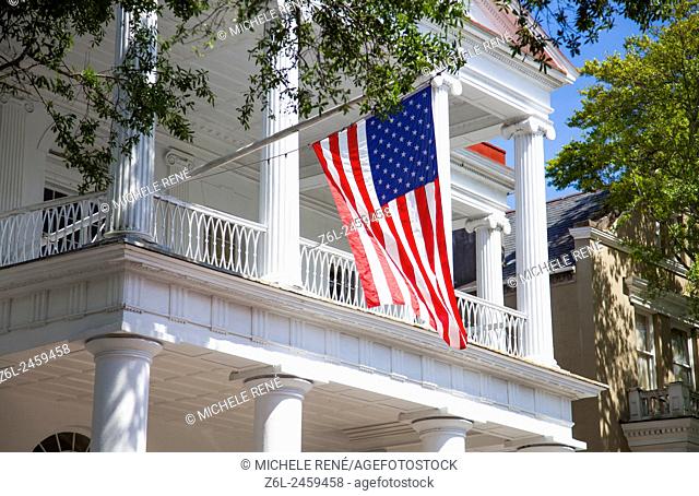 Southern Historic patriotic home flying American flag in Charleston, South Carolina USA