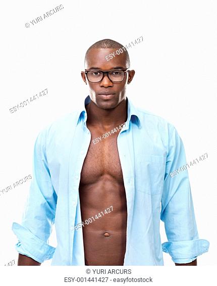 Portrait of a sexy young african american man looking confidently against white background
