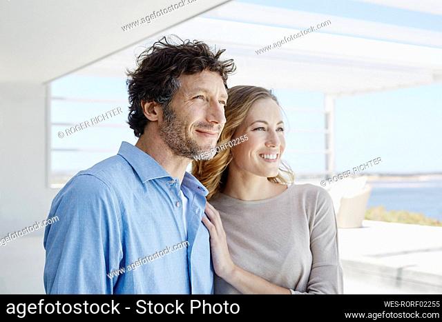 Couple at luxury beach house enjoying the view