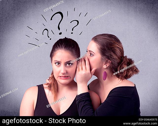 A teenager girl looking confused with drawn question marks above the head, while a girlfriend whispers something in her ear concept