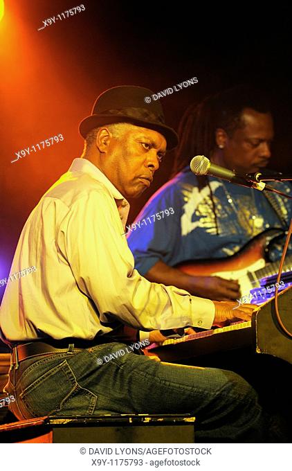 Booker T  Jones, US blues singer musician plays Hammond B3 organ  Main stage marquee  Maryport Blues Festival, 2010  England
