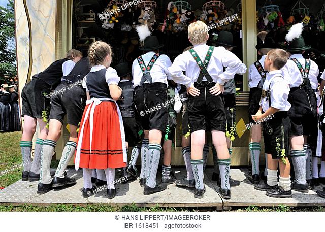 Girl and boys at a shooting gallery, Loisachgau folklore festival, Neufahrn, Upper Bavaria, Bavaria, Germany, Europe