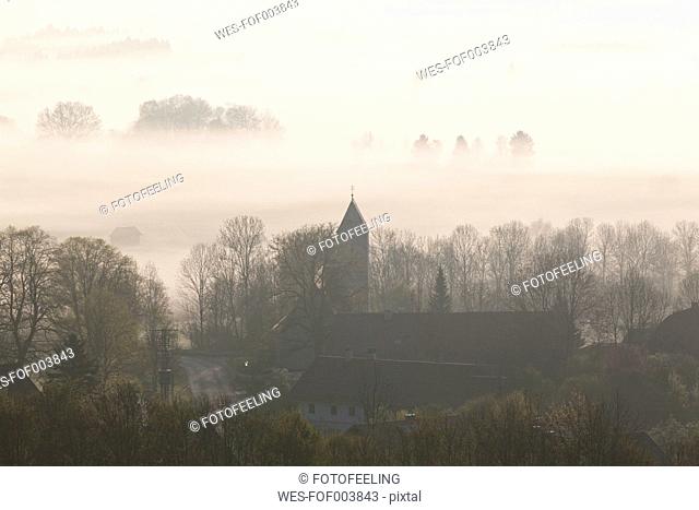 Germany, Bavaria, View of church in fog