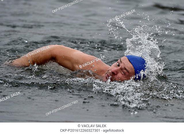 Roman Sproch, along with other contestants, swims in the Dyje river during 42th Christmas Kilometer Race, a Christmas winter swimmers meeting, in Breclav
