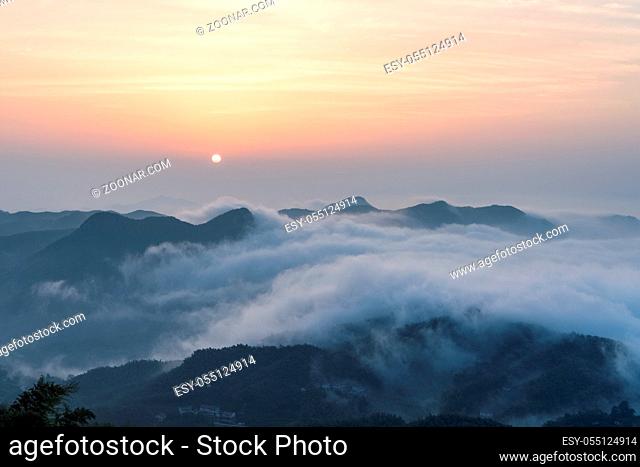 the sunrise and the sea of clouds at the top of the mountain