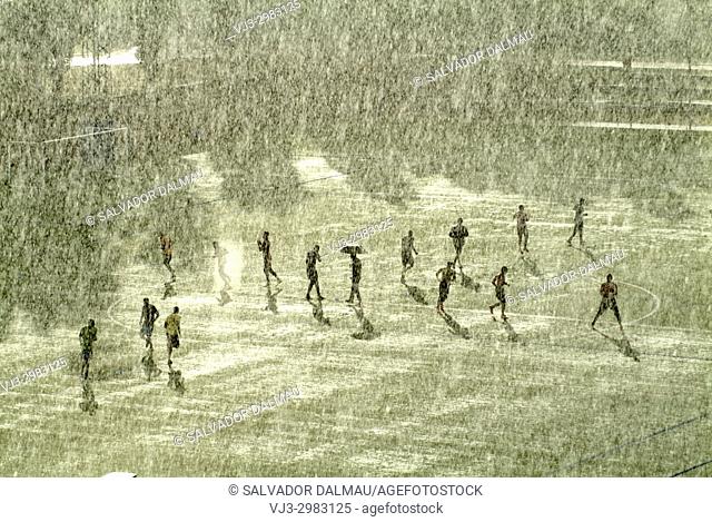 soccer training under the rain, Banyoles, girona, catalonia