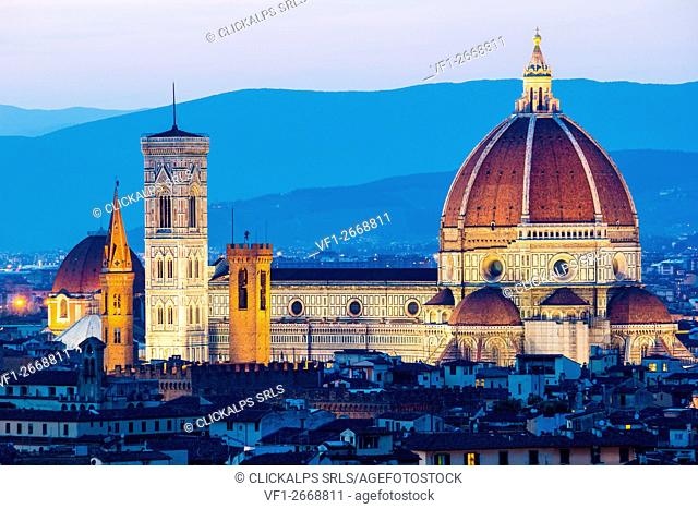 Florence, Tuscany, Italy. Cytiscape with the Cathedral and the Brunelleschi Dome, Giotto Tower at sunset, lights on