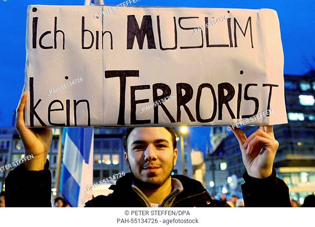 A counter-demonstrators protests against the Islam-critical movement of Bragida (Braunschweig against the Islamization of the West) with a sign that reads 'I am...