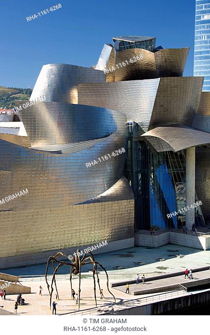 Architect Frank Gehry's Guggenheim Museum futuristic architectural design in titanium and glass, giant spider sculpture 'Maman' in Bilbao, Spain