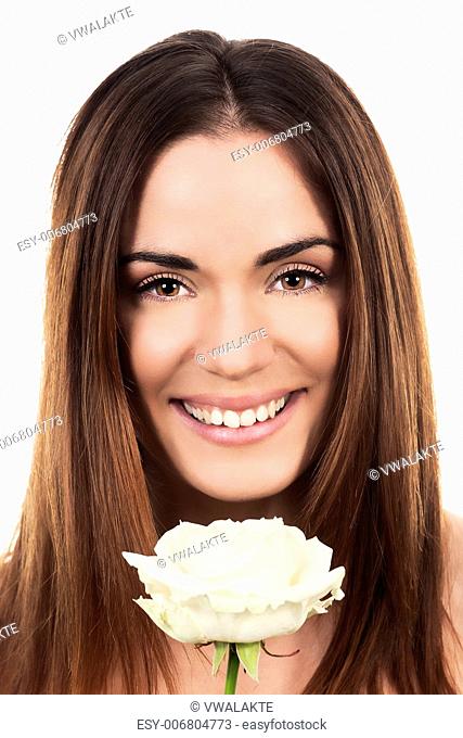 cute woman with white rose in studio