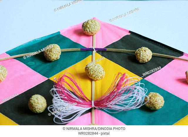 Festival of India , Makara sankranti , kites thread and til laddoos or jaggery and sesame balls , Maharashtra , India