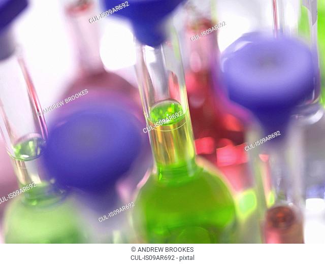 Close up of laboratory glassware flasks containing chemicals in a laboratory