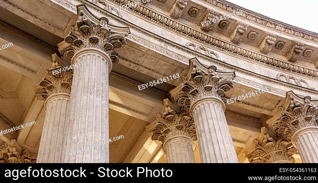 Vintage Old Justice Courthouse Column. Stone column ancient classic architecture detail. Abstract view of neoclassical fluted columns bases and steps of Court...