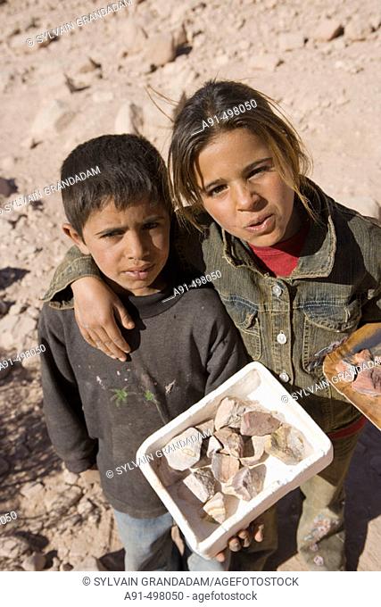 Bedouin child selling stones. Nabatean site of Petra. Kingdom of Jordan