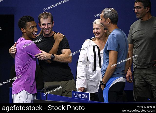 Canadian Felix Auger-Aliassime and his family and coaches celebrate after winning the men's singles final match between Canadian Auger-Aliassime and American...