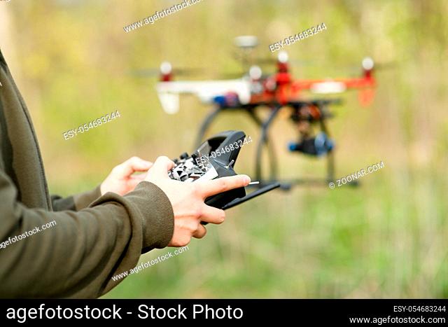 Man controling a drone