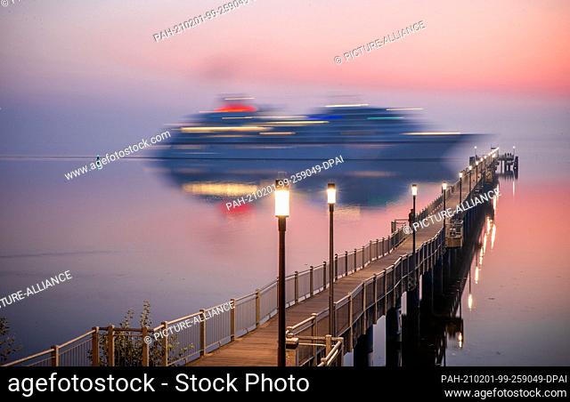 16 September 2020, Mecklenburg-Western Pomerania, Wismar: The cruise ship ""Europa"" passes the pier in Wismar-Wendorf and docks in the port of the Hanseatic...