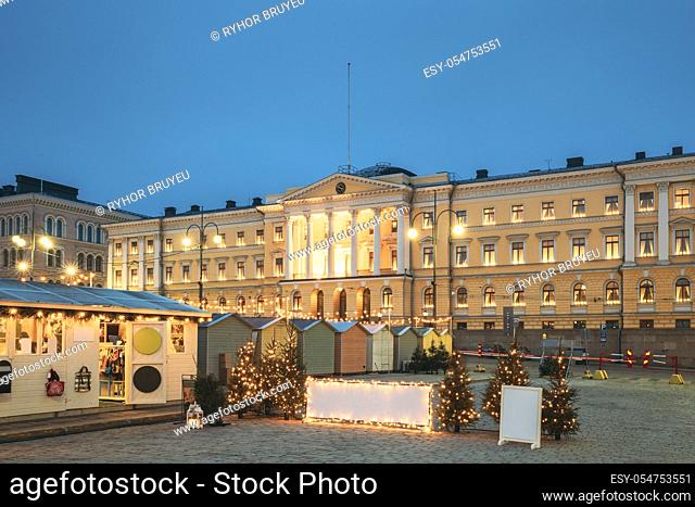 Helsinki, Finland. Xmas Market On Senate Square With Holiday Carousel And Famous Landmark Is Lutheran Cathedral And Monument To Russian Emperor Alexander II At...