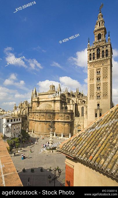La Giralda tower and cathedral seen across Plaza Virgen de los Reyes, Seville Spain