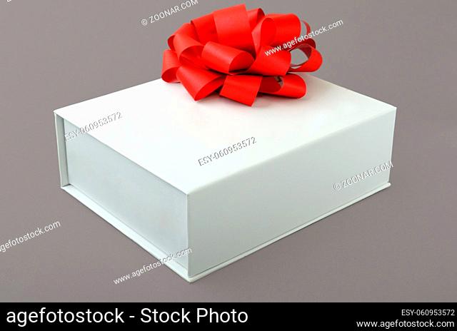 white box with a bow on a gray background