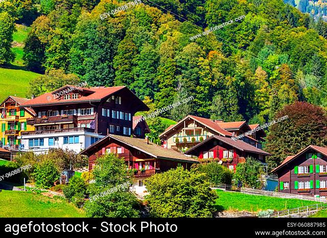 Lauterbrunnen, Switzerland alpine wooden houses in Swiss Alps village in autumn