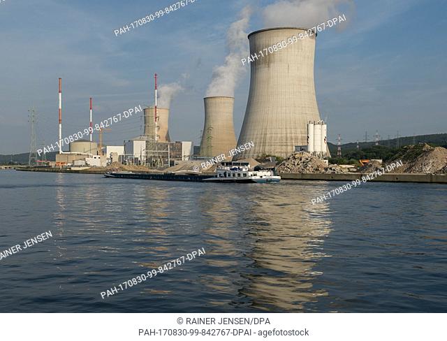 The three cooling towers of the nuclear energy plant are steaming next to the river Maas in Tihange, Belgium, 28 August 2017