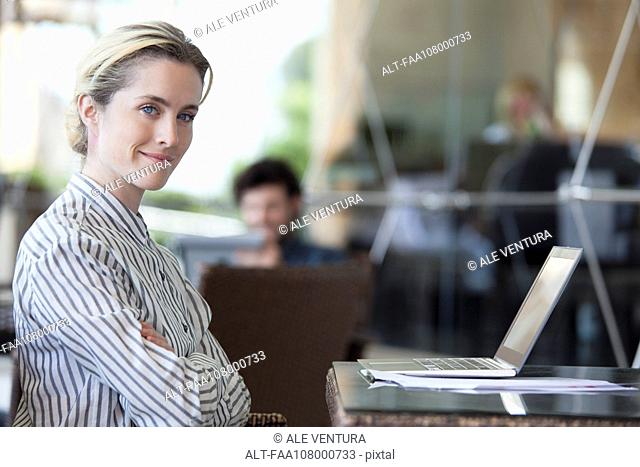 Businesswoman in office, portrait
