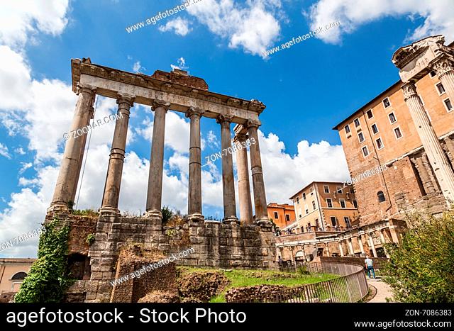 Rome, Italy - June 30, 2014: ancient columns in the Roman Forum in Rome. It was for centuries the center of Roman life, today a sprawling ruin of fragments and...