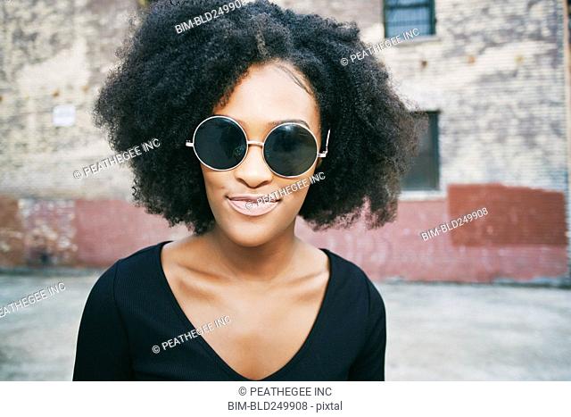 Portrait of smiling Black woman outdoors