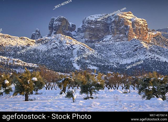 Roques de Benet rocks, near Horta de Sant Joan, in a winter snowy sunset after a heavy snowfall (Terra Alta, Tarragona, Catalonia, Spain)