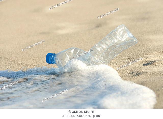 Abandonded plastic bottle on beach