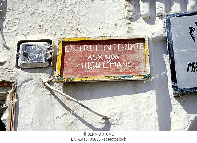 Sign on wall. French language. Entry fobidden to non-Muslims