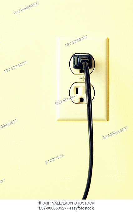 Outlet on wall with plug