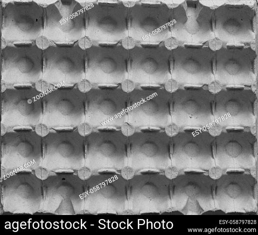 External side of chicken egg tray made of recycled paper, abstract background