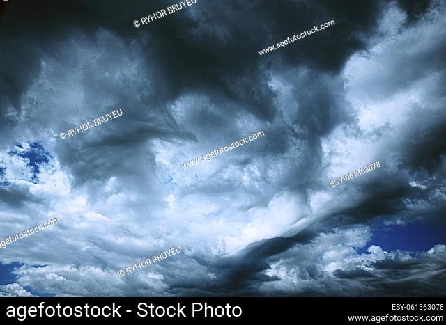 Dark Storm Cloudy Rainy Sky With Rain Heavy Clouds. Sky Natural Background. Weather Forecast Concept. heavy raging turbulent cloudscape